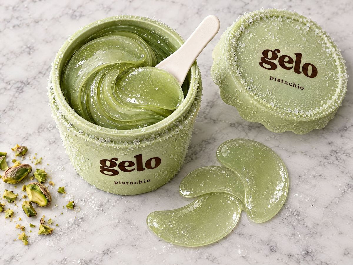 An open pistachio pint full of swirled green gel patches, with a few laid out on marble.